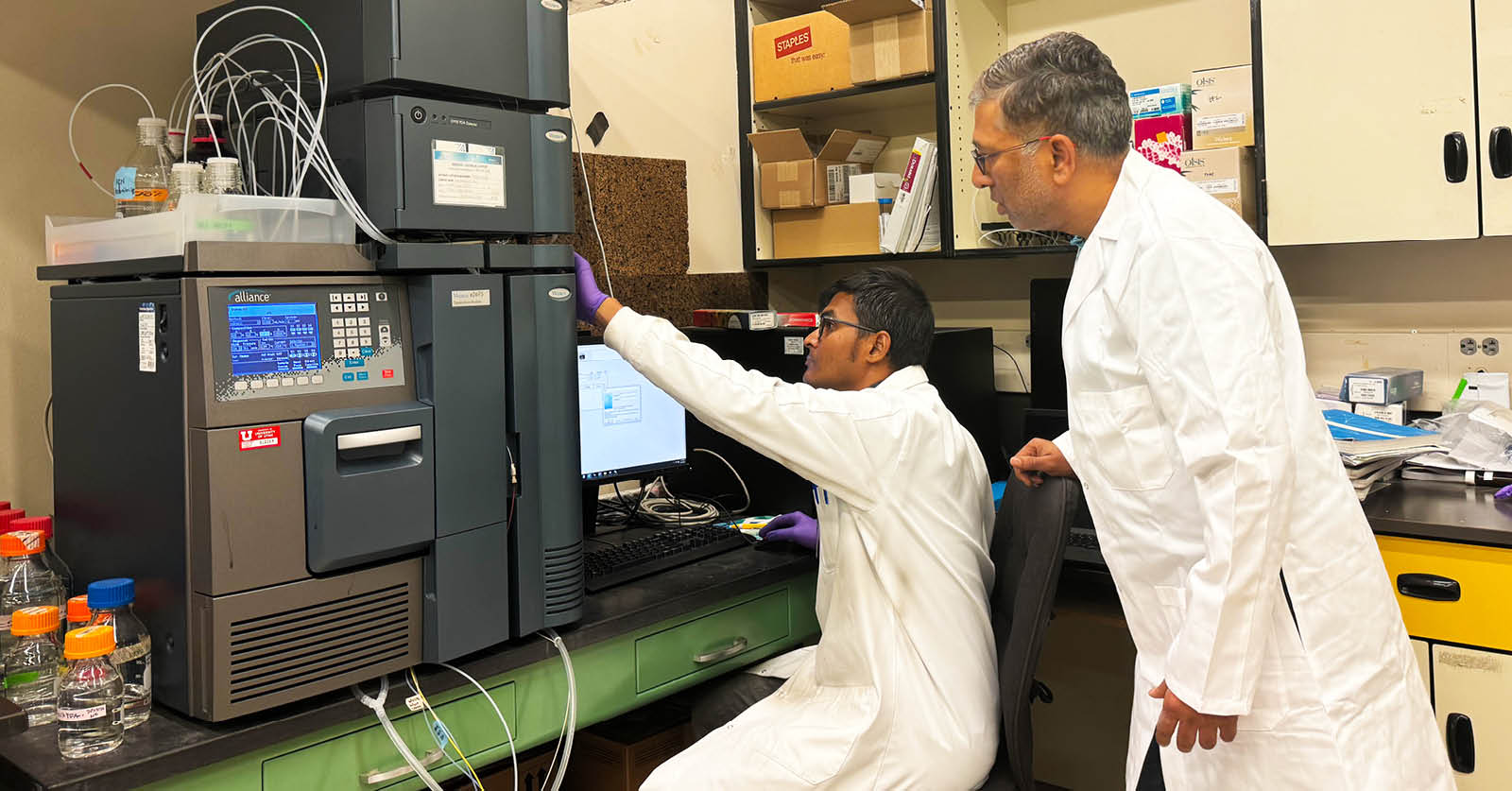 Dr. Goel with PhD student Goswami in lab